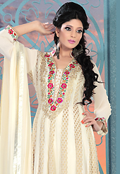 The glamorous silhouette to meet your most dire fashion needs. The dazzling beige faux georgette readymade churidar suit have amazing embroidery patch work is done with resham, zari and stone work. Beautiful embroidery work on kameez is stunning. The entire ensemble makes an excellent wear. Matching churidar and dupatta is available with this suit. Slight Color variations are possible due to differing screen and photograph resolutions.