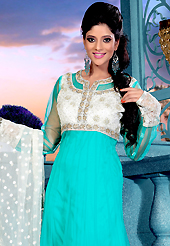 This season dazzle and shine in pure colors. The dazzling aqua blue net readymade churidar suit have amazing embroidery patch work is done with zardosi, sequins, stone, beads and cutbeads work. Beautiful embroidery work on kameez is stunning. The entire ensemble makes an excellent wear. Matching churidar and off white net dupatta is available with this suit. Slight Color variations are possible due to differing screen and photograph resolutions.