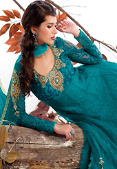 Attract all attentions with this embroidered suit. The dazzling teal green net and jacquard churidar suit have amazing embroidery patch bordered work is done with resham, zari, stone and beads work. Beautiful embroidery work on kameez is stunning. The entire ensemble makes an excellent wear. Matching santoon churidar and chiffon dupatta is available with this suit. Slight Color variations are possible due to differing screen and photograph resolutions.