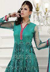 The color range from natural shades looks ravishing. The dazzling turquoise green net readymade churidar suit have amazing embroidery and velvet patch work is done with zari and applique work. Beautiful embroidery work on kameez is stunning. The entire ensemble makes an excellent wear. Matching santoon churidar and net dupatta is available with this suit. Slight Color variations are possible due to differing screen and photograph resolutions.