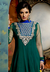Outfit is a novel ways of getting yourself noticed. The dazzling teal green and blue net anarkali churidar suit have amazing embroidery patch work is done with resham, zari, stone and lace work. The entire ensemble makes an excellent wear. Matching teal green churidar and double dye dupatta is available with this suit. Slight Color variations are possible due to differing screen and photograph resolutions.