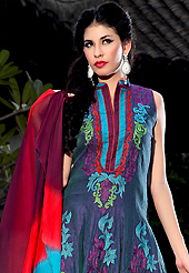 A desire that evokes a sense of belonging with a striking details. The dazzling navy blue dupion silk and raw silk readymade churidar suit have amazing floral print and embroidery patch bordered work is done with resham work. Beautiful embroidery work on kameez is stunning. The entire ensemble makes an excellent wear. Contrasting red churidar and shaded dupatta is available with this suit. Slight Color variations are possible due to differing screen and photograph resolutions.