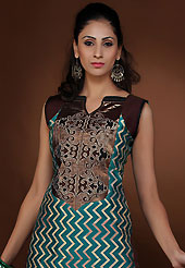 Let your personality articulate for you with this amazing embroidered suit. The dazzling teal green chanderi art silk churidar suit have amazing embroidery patch work is done with resham thread and zari work. The entire ensemble makes an excellent wear. Contrasting dark brown churidar and chiffon dupatta is available with this suit. Slight Color variations are possible due to differing screen and photograph resolutions.