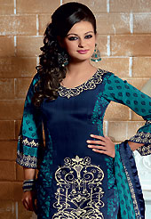 Style and trend will be at the peak of your beauty when you adorn this suit. The dazzling blue crepe churidar suit have amazing floral print and embroidery patch work is done with resham, sequins and applique work. The entire ensemble makes an excellent wear. Matching churidar and printed dupatta is available with this suit. Slight Color variations are possible due to differing screen and photograph resolutions.