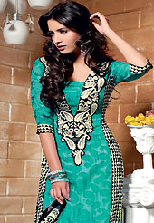 This season dazzle and shine in pure colors. The dazzling turquoise green and black georgette jacquard churidar suit have amazing geometric, paisley print and embroidery patch work is done with resham, stone and applique work. The entire ensemble makes an excellent wear. Matching churidar and dupatta is available with this suit. Slight Color variations are possible due to differing screen and photograph resolutions.