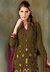 A desire that evokes a sense of belonging with a striking details. This dark olive green cotton churidar suit have amazing embroidery and patch work is done with resham work. Embroidery on kameez is highlighting the beauty of this suit. Contrasting dark purple churidar and double dye chiffon dupatta come along with this suit. Slight Color variations are possible due to differing screen and photograph resolutions.