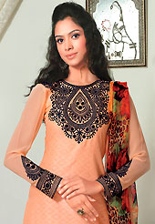 Dreamy variation on shape and forms compliment your style with tradition. The dazzling peach cotton jacquard salwar kameez have amazing embroidery patch work is done with resham work. Beautiful embroidery work on kameez is stunning. Matching printed salwar and printed chiffon dupatta is available with this suit. Slight Color variations are possible due to differing screen and photograph resolutions.