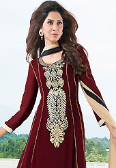 The glamorous silhouette to meet your most dire fashion needs. The dazzling maroon faux georgette churidar suit have amazing embroidery patch work is done with resham work. Beautiful embroidery work on kameez is stunning. The entire ensemble makes an excellent wear. Contrasting cream churidar and cream dupatta is available with this suit. Slight Color variations are possible due to differing screen and photograph resolutions.