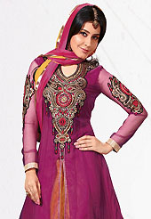Your search for elegant look ends here with this lovely suit. The dazzling dark magenta net lehenga churidar suit have amazing embroidery patch work is done with resham, zari and stone work. Beautiful embroidery work on kameez is stunning. The entire ensemble makes an excellent wear. Contrasting mustard lehenga churidar and dupatta is available with this suit. Slight Color variations are possible due to differing screen and photograph resolutions.