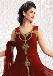 Dreamy variation on shape and forms compliment your style with tradition. The dazzling maroon georgette churidar suit have amazing embroidery patch bordered work is done with antique zardosi, cutdana, stones, bugle beads and lace work. Beautiful embroidery work on kameez is stunning. The entire ensemble makes an excellent wear. Matching churidar and dupatta is available with this suit. Slight Color variations are possible due to differing screen and photograph resolutions.