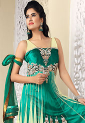 The most beautiful refinements for style and tradition. The dazzling turquoise green and cream net churidar suit have amazing embroidery patch bordered work is done with cutdana, stones, bugle beads and lace work. Beautiful embroidery work on kameez is stunning. The entire ensemble makes an excellent wear. Matching churidar and dupatta is available with this suit. Slight Color variations are possible due to differing screen and photograph resolutions.