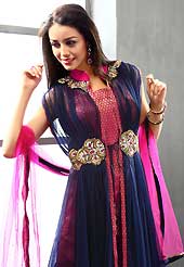 An occasion wear perfect is ready to rock you. The dazzling navy blue and dark pink net and brocade readymade churidar suit have amazing embroidery patch work is done with cutdana, zardosi, stone and beads work. Beautiful embroidery work on kameez is stunning. The entire ensemble makes an excellent wear. Matching dark pink santoon churidar and dark pink net dupatta is available with this suit. Slight Color variations are possible due to differing screen and photograph resolutions.