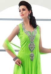 Look stunning rich with dark shades and floral patterns. The dazzling lime green net readymade churidar suit have amazing embroidery patch work is done with stone, cutdana, beads and lace work. Beautiful embroidery work on kameez is stunning. The entire ensemble makes an excellent wear. Matching churidar and dupatta is available with this suit. Slight Color variations are possible due to differing screen and photograph resolutions.