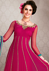 It is color this season and bright shaded suits are really something that is totally in vogue. The dazzling dark magenta net georgette churidar suit have amazing embroidery patch work is done with resham, zari, stone, beads and lace work. Beautiful embroidery work on kameez is stunning. The entire ensemble makes an excellent wear. Matching santoon churidar and turquoise green dupatta is available with this suit. Slight Color variations are possible due to differing screen and photograph resolutions.