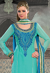 A desire that evokes a sense of belonging with a striking details. The dazzling turquoise blue cotton churidar suit have amazing embroidery patch work is done with resham work. Beautiful embroidery work on kameez is stunning. Matching churidar and blue chiffon dupatta is available with this suit. Slight Color variations are possible due to differing screen and photograph resolutions.