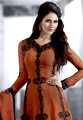 The fascinating beautiful subtly garment with lovely patterns. The dazzling rust orange georgette churidar suit have amazing embroidery patch work is done with resham, sequins and lace work. Beautiful embroidery work on kameez is stunning. The entire ensemble makes an excellent wear. Matching santoon churidar and chiffon dupatta is available with this suit. Slight Color variations are possible due to differing screen and photograph resolutions.