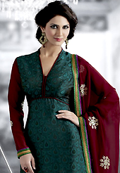 This season dazzle and shine in pure colors. The dazzling dark teal green crepe jacquard churidar suit have amazing embroidery patch work is done with resham and zari work. Beautiful embroidery work on kameez is stunning. The entire ensemble makes an excellent wear. Matching santoon churidar and maroon chiffon dupatta is available with this suit. Slight Color variations are possible due to differing screen and photograph resolutions.