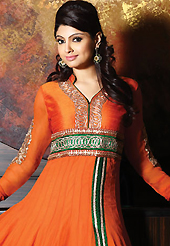 Your search for elegant look ends here with this lovely suit. The dazzling deep orange georgette and raw silk churidar suit have amazing embroidery patch work is done with zari and kasab work. Beautiful embroidery work on kameez is stunning. The entire ensemble makes an excellent wear. Matching churidar and dupatta is available with this suit. Slight Color variations are possible due to differing screen and photograph resolutions.