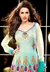 This season dazzle and shine in pure colors. The dazzling shaded turquoise net anarkali churidar suit have amazing embroidery patch work is done with resham, zari, stone and lace work. Beautiful embroidery work on kameez is stunning. The entire ensemble makes an excellent wear. Matching santoon churidar and chiffon dupatta is available with this suit. Slight Color variations are possible due to differing screen and photograph resolutions.