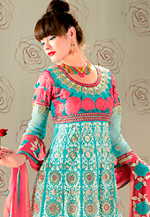 Try out this year top trend, glowing, bold and natural collection. The dazzling aqua blue georgette churidar suit have amazing embroidery patch work is done with resham, zari and stone work. The entire ensemble makes an excellent wear. Matching santoon churidar and pink chiffon dupatta is available with this suit. Slight Color variations are possible due to differing screen and photograph resolutions.