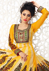 Ultimate collection of embroidered suits with fabulous style. The dazzling dark yellow and cream net readymade anarkali churidar suit have amazing embroidery patch work is done with resham, zari, stone, cutdana, beads and lace work. Beautiful embroidery work on kameez is stunning. The entire ensemble makes an excellent wear. Matching churidar and dupatta is available with this suit. Slight Color variations are possible due to differing screen and photograph resolutions.