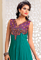 This season dazzle and shine in pure colors. The dazzling turquoise green net readymade anarkali churidar suit have amazing embroidery patch work is done with resham, zari, sequins and stone work. Beautiful embroidery work on kameez is stunning. The entire ensemble makes an excellent wear. Matching churidar and dupatta is available with this suit. Slight Color variations are possible due to differing screen and photograph resolutions.