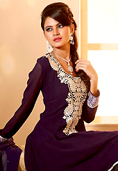 The glamorous silhouette to meet your most dire fashion needs. The dazzling dark purple georgette churidar suit have amazing embroidery patch work is done with resham, sequins and stone work. Beautiful embroidery work on kameez is stunning. The entire ensemble makes an excellent wear. Matching churidar and dupatta is available with this suit. Slight Color variations are possible due to differing screen and photograph resolutions.
