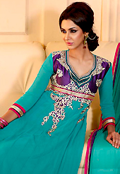 The fascinating beautiful subtly garment with lovely patterns. The dazzling turquoise green georgette churidar suit have amazing embroidery patch work is done with resham, zari, sequins and stone work. Beautiful embroidery work on kameez is stunning. The entire ensemble makes an excellent wear. Matching churidar and dupatta is available with this suit. Slight Color variations are possible due to differing screen and photograph resolutions.