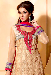 An occasion wear perfect is ready to rock you. The dazzling fawn net churidar suit have amazing embroidery patch work is done with resham, zari and sequins work. Beautiful embroidery work on kameez is stunning. The entire ensemble makes an excellent wear. Contrasting red churidar and dupatta is available with this suit. Slight Color variations are possible due to differing screen and photograph resolutions.