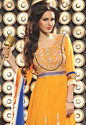 It is color this season and bright shaded suits are really something that is totally in vogue. The dazzling orange viscose georgette churidar suit have amazing embroidery patch work is done with resham, zari, stone, beads and lace work. Beautiful embroidery work on kameez is stunning. The entire ensemble makes an excellent wear. Contrasting blue santoon churidar and shaded dupatta is available with this suit. Slight Color variations are possible due to differing screen and photograph resolutions.