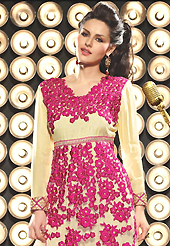 The glamorous silhouette to meet your most dire fashion needs. The dazzling light fawn net and viscose georgette churidar suit have amazing embroidery patch work is done with resham, zari and sequins work. Beautiful embroidery work on kameez is stunning. The entire ensemble makes an excellent wear. Contrasting pink santoon churidar and light fawn dupatta is available with this suit. Slight Color variations are possible due to differing screen and photograph resolutions.