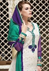 Look stunning rich with dark shades and floral patterns. The dazzling off white cotton churidar suit have amazing embroidery patch work is done with resham, zari and stone work. The entire ensemble makes an excellent wear. Contrasting purple churidar and double dye chiffon dupatta is available with this suit. Slight Color variations are possible due to differing screen and photograph resolutions.