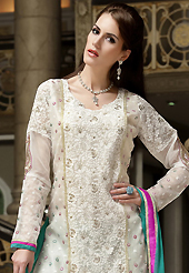 Get ready to sizzle all around you by sparkling suit. The dazzling off white cotton salwar kameez have amazing embroidery patch work is done with resham, zari and sequins work. The entire ensemble makes an excellent wear. Contrasting green salwar and green chiffon dupatta is available with this suit. Slight Color variations are possible due to differing screen and photograph resolutions.