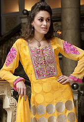 Look stunning rich with dark shades and floral patterns. The dazzling bright yellow cotton churidar suit have amazing embroidery patch work is done with resham, zari and lace work. The entire ensemble makes an excellent wear. Matching churidar and chiffon dupatta is available with this suit. Slight Color variations are possible due to differing screen and photograph resolutions.