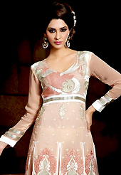 Take a look on the changing fashion of the season. The dazzling beige viscose georgette churidar suit have amazing embroidery patch work is done with resham and sequins work. Beautiful embroidery work on kameez is stunning. The entire ensemble makes an excellent wear. Contrasting light grey churidar and shaded dupatta is available with this suit. Slight Color variations are possible due to differing screen and photograph resolutions.