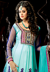 It is color this season and bright shaded suits are really something that is totally in vogue. The dazzling aqua blue net churidar suit have amazing embroidery patch work is done with resham, zari, sequins, stone, beads and lace work. Beautiful embroidery work on kameez is stunning. The entire ensemble makes an excellent wear. Contrasting purple santoon churidar and aqua blue net dupatta is available with this suit. Slight Color variations are possible due to differing screen and photograph resolutions.
