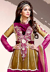 A desire that evokes a sense of belonging with a striking details. The dazzling dark fawn and dark magenta net churidar suit have amazing embroidery patch work is done with resham, zari, stone and lace work. Beautiful embroidery work on kameez is stunning. Matching dark magenta santoon churidar and shaded dupatta is available with this suit. Slight Color variations are possible due to differing screen and photograph resolutions.