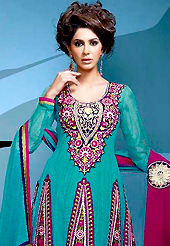 Breathtaking collection of suits with stylish embroidery work and fabulous style. The dazzling turquoise green net churidar suit have amazing embroidery patch work is done with resham, zari, stone and lace work. Beautiful embroidery work on kameez is stunning. Contrasting magenta santoon churidar and double dye chiffon dupatta is available with this suit. Slight Color variations are possible due to differing screen and photograph resolutions.