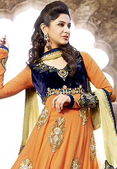 The glamorous silhouette to meet your most dire fashion needs. The dazzling orange faux georgette and velvet anarkali churidar suit have amazing embroidery patch work is done with resham, zari, sequins, stone and lace work. Beautiful embroidery work on kameez is stunning. The entire ensemble makes an excellent wear. Matching santoon churidar and cream chiffon dupatta is available with this suit. Slight Color variations are possible due to differing screen and photograph resolutions.