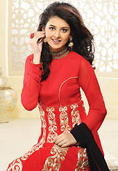 Dreamy variation on shape and forms compliment your style with tradition. The dazzling salsa red faux georgette readymade churidar suit have amazing embroidery patch work is done with zari work. The entire ensemble makes an excellent wear. Matching churidar and black dupatta is available with this suit. Slight Color variations are possible due to differing screen and photograph resolutions.