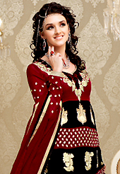 The glamorous silhouette to meet your most dire fashion needs. The dazzling maroon and black georgette churidar suit have amazing embroidery patch work is done with resham, zari and lace work. Beautiful embroidery work on kameez is stunning. The entire ensemble makes an excellent wear. Matching maroon santoon churidar and maroon chiffon dupatta is available with this suit. Slight Color variations are possible due to differing screen and photograph resolutions.