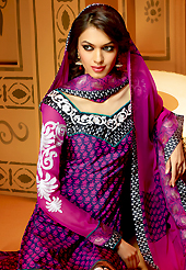 Look stunning rich with dark shades and floral patterns. The dazzling dark blue and magenta faux crepe churidar suit have amazing embroidery patch work is done with resham and zari work. The entire ensemble makes an excellent wear. Matching dark blue santoon churidar and magenta dupatta is available with this suit. Slight Color variations are possible due to differing screen and photograph resolutions.