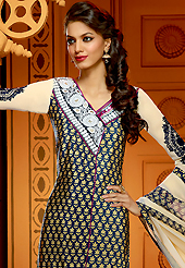 Your search for elegant look ends here with this lovely suit. The dazzling dark navy blue and buttercream faux crepe churidar suit have amazing embroidery patch work is done with resham, zari, stone and mirror work. The entire ensemble makes an excellent wear. Matching dark navy blue churidar and buttercream dupatta is available with this suit. Slight Color variations are possible due to differing screen and photograph resolutions.