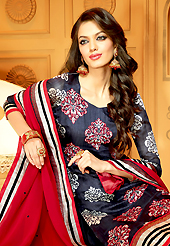 The glamorous silhouette to meet your most dire fashion needs. The dazzling dark navy blue faux crepe churidar suit have amazing embroidery patch work is done with resham, zari and stone work. The entire ensemble makes an excellent wear. Matching churidar and red dupatta is available with this suit. Slight Color variations are possible due to differing screen and photograph resolutions.
