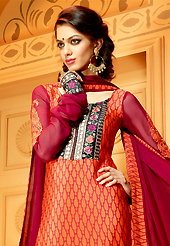 Outfit is a novel ways of getting yourself noticed. The dazzling orange faux crepe churidar suit have amazing embroidery patch work is done with resham, zari, sequins and stone work. The entire ensemble makes an excellent wear. Contrasting maroon churidar and maroon dupatta is available with this suit. Slight Color variations are possible due to differing screen and photograph resolutions.