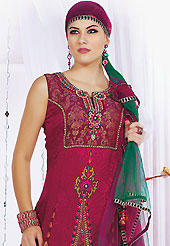 Embroidered suits are the best choice for a girl to enhance her feminine look. The dazzling dark magenta jacquard readymade churidar suit have amazing embroidery patch work is done with resham, stone, cutdana, cut moti, kasab and lace work. Beautiful embroidery work on kameez is stunning. The entire ensemble makes an excellent wear. Matching santoon churidar and shaded net dupatta is available with this suit. Slight Color variations are possible due to differing screen and photograph resolutions.