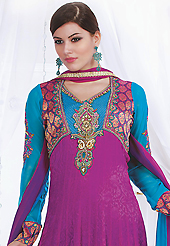 The fascinating beautiful subtly garment with lovely patterns. The dazzling magenta faux crepe jacquard readymade churidar suit have amazing embroidery and velvet patch bordered work is done with resham, stone, cutdana, kasab, moti and lace work. Beautiful embroidery work on kameez is stunning. The entire ensemble makes an excellent wear. Contrasting teal blue santoon churidar and shaded faux georgette dupatta is available with this suit. Slight Color variations are possible due to differing screen and photograph resolutions.