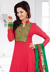 Your search for elegant look ends here with this lovely suit. The dazzling deep pink georgette jacquard anarkali churidar suit have amazing embroidery patch work is done with resham, zari and sequins work. Beautiful embroidery work on kameez is stunning. The entire ensemble makes an excellent wear. Matching santoon churidar and faux chiffon dupatta is available with this suit. Slight Color variations are possible due to differing screen and photograph resolutions.