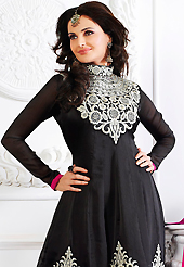 Look stunning rich with dark shades and floral patterns. The dazzling black satin chiffon anarkali churidar suit have amazing embroidery patch work is done with resham and stone work. Beautiful embroidery work on kameez is stunning. The entire ensemble makes an excellent wear. Matching santoon churidar and faux georgette dupatta is available with this suit. Slight Color variations are possible due to differing screen and photograph resolutions.