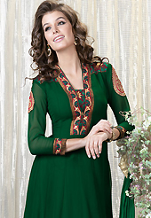 It is color this season and bright shaded suits are really something that is totally in vogue. The dazzling dark green faux georgette churidar suit have amazing embroidery patch work is done with resham and zari work. Beautiful embroidery work on kameez is stunning. The entire ensemble makes an excellent wear. Contrasting red santoon churidar and double dye chiffon dupatta is available with this suit. Slight Color variations are possible due to differing screen and photograph resolutions.